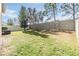 Spacious backyard with grassy area and privacy fence at 18811 Deer Tracks Loop, Lutz, FL 33558