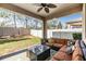Covered patio with seating area, perfect for outdoor entertaining at 18811 Deer Tracks Loop, Lutz, FL 33558