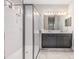 Spa-like bathroom with double vanity, large shower, and modern fixtures at 18811 Deer Tracks Loop, Lutz, FL 33558