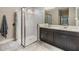 Elegant bathroom with double vanity, large shower, and modern fixtures at 18811 Deer Tracks Loop, Lutz, FL 33558