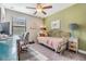 Versatile bedroom with daybed and workspace, perfect for guests or a home office at 18811 Deer Tracks Loop, Lutz, FL 33558