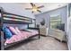 Charming bedroom with a bunk bed and plenty of storage at 18811 Deer Tracks Loop, Lutz, FL 33558