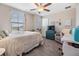 Comfortable bedroom with a queen-size bed and plenty of space for a home office at 18811 Deer Tracks Loop, Lutz, FL 33558