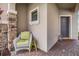 Inviting front porch with wicker chair and side table at 18811 Deer Tracks Loop, Lutz, FL 33558