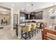 Modern kitchen with dark cabinets, granite counters, and island at 18811 Deer Tracks Loop, Lutz, FL 33558