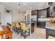 Modern kitchen with dark cabinets, granite counters, and island at 18811 Deer Tracks Loop, Lutz, FL 33558