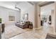 Cozy living room featuring a comfortable couch and access to other areas of the home at 18811 Deer Tracks Loop, Lutz, FL 33558