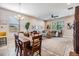 Spacious living room with sectional sofa, large TV, and ceiling fan at 18811 Deer Tracks Loop, Lutz, FL 33558