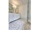 Elegant bathroom with double vanity, frameless shower, and marble floors at 19018 Geraci Rd, Lutz, FL 33548