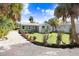 Landscaped backyard with gravel driveway and home view at 2353 Grove S St, St Petersburg, FL 33705