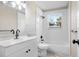 Clean bathroom with white vanity, tub, and shower at 2353 Grove S St, St Petersburg, FL 33705