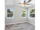 Bright bedroom with wood-look floors and multiple windows at 2353 Grove S St, St Petersburg, FL 33705