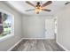 Well-lit bedroom with vinyl flooring, ceiling fan, and ample natural light at 2353 Grove S St, St Petersburg, FL 33705