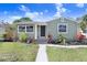 Charming bungalow with gray siding, landscaped yard, and walkway at 2353 Grove S St, St Petersburg, FL 33705