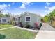 Charming bungalow with green exterior and landscaped yard at 2353 Grove S St, St Petersburg, FL 33705