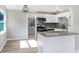 Modern kitchen with white cabinets, granite counters, and stainless appliances at 2353 Grove S St, St Petersburg, FL 33705