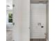 White laundry closet with built-in shelving and hookups at 2353 Grove S St, St Petersburg, FL 33705