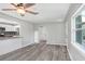 Open living room with wood-look vinyl flooring and kitchen view at 2353 Grove S St, St Petersburg, FL 33705