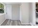 Sunroom features wood-look floors and multiple windows at 2353 Grove S St, St Petersburg, FL 33705