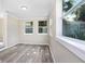 Sunroom with wood-look floors and windows for natural light at 2353 Grove S St, St Petersburg, FL 33705