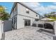 Private backyard patio with pavers, grill, and string lights at 2704 W Gray St # B, Tampa, FL 33609