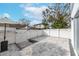 Backyard patio with pavers, white fence, and string lights at 2704 W Gray St # B, Tampa, FL 33609