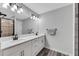 Modern bathroom with double vanity and a large mirror at 2704 W Gray St # B, Tampa, FL 33609