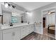 Double vanity bathroom with a view of bedroom at 2704 W Gray St # B, Tampa, FL 33609