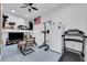 Home gym with treadmill, weights, and TV at 2704 W Gray St # B, Tampa, FL 33609