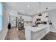 Modern kitchen with white cabinets, stainless steel appliances, and island at 2704 W Gray St # B, Tampa, FL 33609