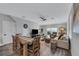 Spacious living room with hardwood floors, sofa, and dining table at 2704 W Gray St # B, Tampa, FL 33609
