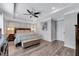 Bright main bedroom with king-size bed and ensuite bathroom at 2704 W Gray St # B, Tampa, FL 33609