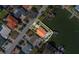 Aerial view of waterfront property with private dock and patio at 2801 Hibiscus W Dr, Belleair Beach, FL 33786