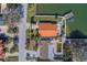 Aerial view of waterfront home with private pool and dock at 2801 Hibiscus W Dr, Belleair Beach, FL 33786