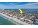 Aerial view of waterfront home with access to beach and marina at 2801 Hibiscus W Dr, Belleair Beach, FL 33786