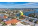 Aerial view of waterfront home, near the water's edge at 2801 Hibiscus W Dr, Belleair Beach, FL 33786