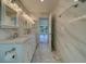 Bathroom boasts a marble shower and double vanity at 2801 Hibiscus W Dr, Belleair Beach, FL 33786