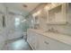 Bathroom with marble shower and double vanity at 2801 Hibiscus W Dr, Belleair Beach, FL 33786