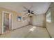 Spacious bedroom with ceiling fan and closet at 2801 Hibiscus W Dr, Belleair Beach, FL 33786