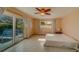 Bedroom with sliding door to patio access at 2801 Hibiscus W Dr, Belleair Beach, FL 33786