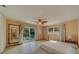 Bedroom with sliding door to patio access at 2801 Hibiscus W Dr, Belleair Beach, FL 33786