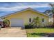 Attached garage with ample storage space at 2801 Hibiscus W Dr, Belleair Beach, FL 33786