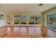 Gathering room with terracotta floors and water views at 2801 Hibiscus W Dr, Belleair Beach, FL 33786