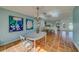 Open concept kitchen with island and white cabinets at 2801 Hibiscus W Dr, Belleair Beach, FL 33786