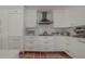 Bright white kitchen with stainless steel appliances at 2801 Hibiscus W Dr, Belleair Beach, FL 33786