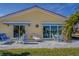 Outdoor patio with seating area, ideal for relaxing at 2801 Hibiscus W Dr, Belleair Beach, FL 33786