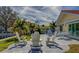Enjoy this peaceful patio with seating, and view of the water at 2801 Hibiscus W Dr, Belleair Beach, FL 33786