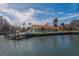 Waterfront home, showcasing private dock and patio at 2801 Hibiscus W Dr, Belleair Beach, FL 33786