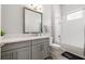 Modern bathroom with gray vanity, white subway tile, and bathtub at 3108 Christophers Watch Ln, Ruskin, FL 33570