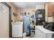 Laundry room with washer, dryer, and water heater at 36441 Lake Pasadena Rd, Dade City, FL 33525